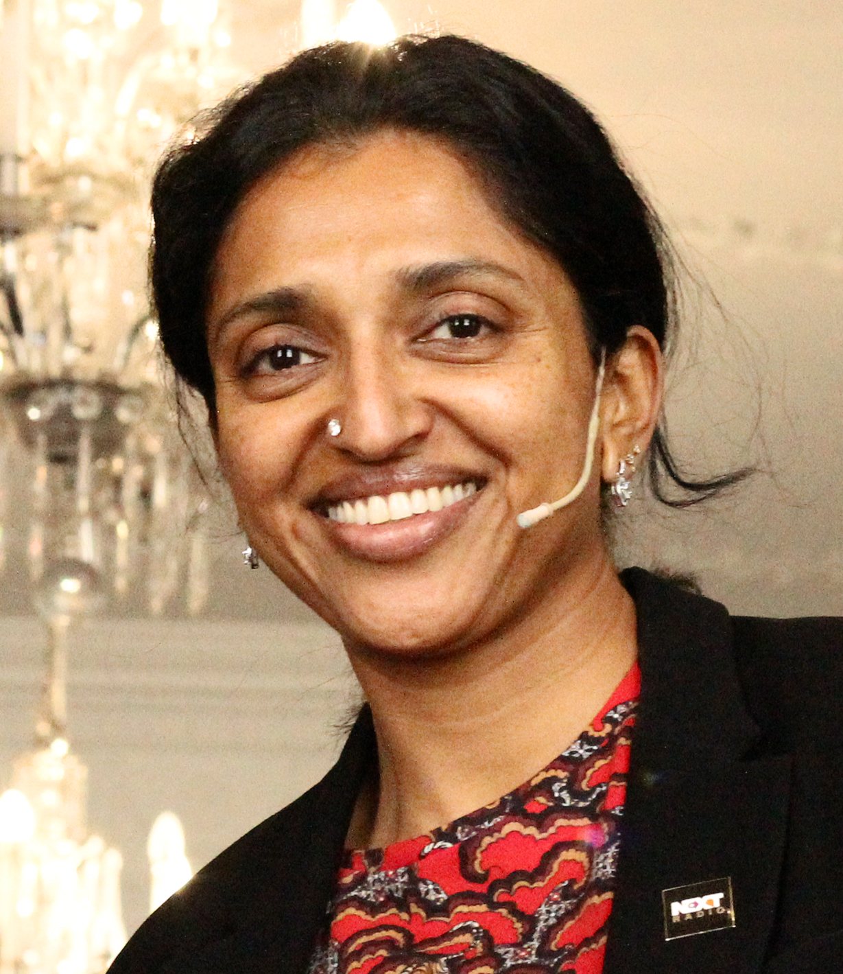 Sindhu Vee wearing a headset microphone at the Next Radio conference, September 2017