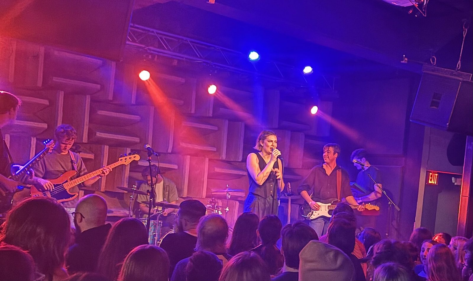 Six Foot Blonde performing live on a club stage, December 2023