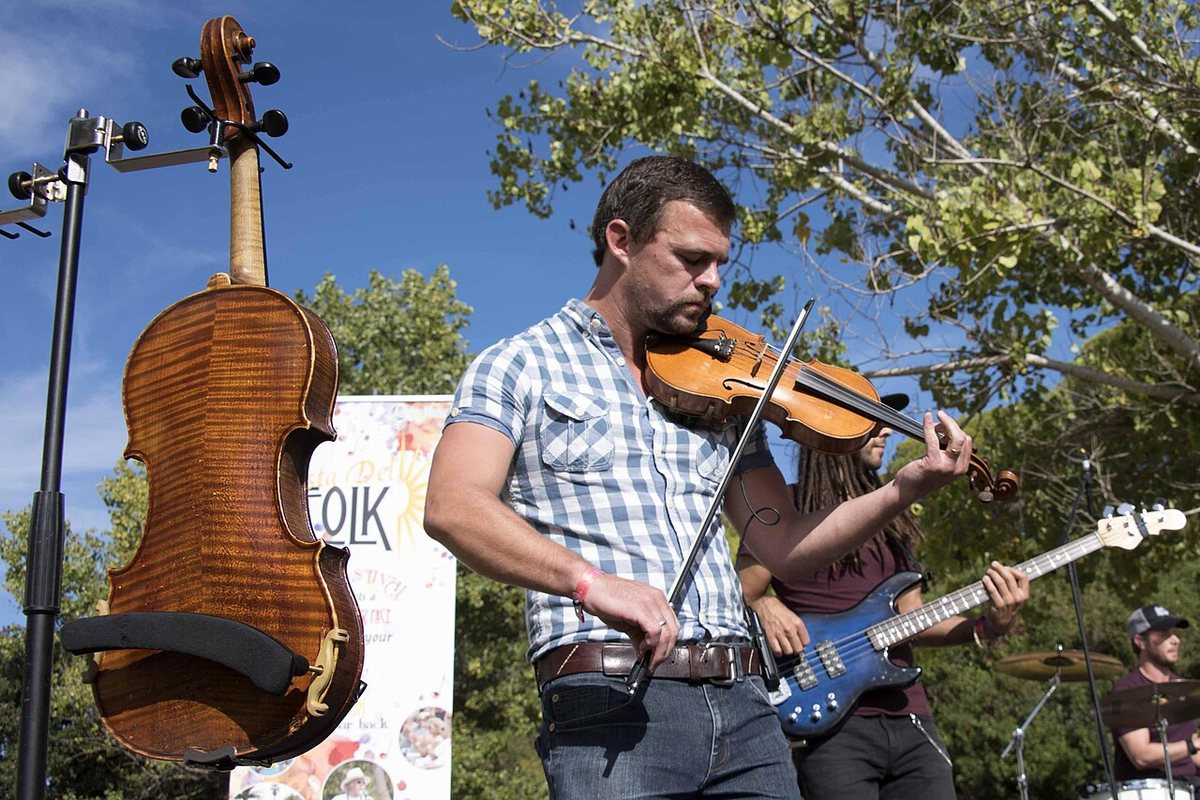 Buy Skerryvore tickets on StubOrder Skerryvore's fiddler performing outdoors at Costa del Folk, Portugal, October 2016