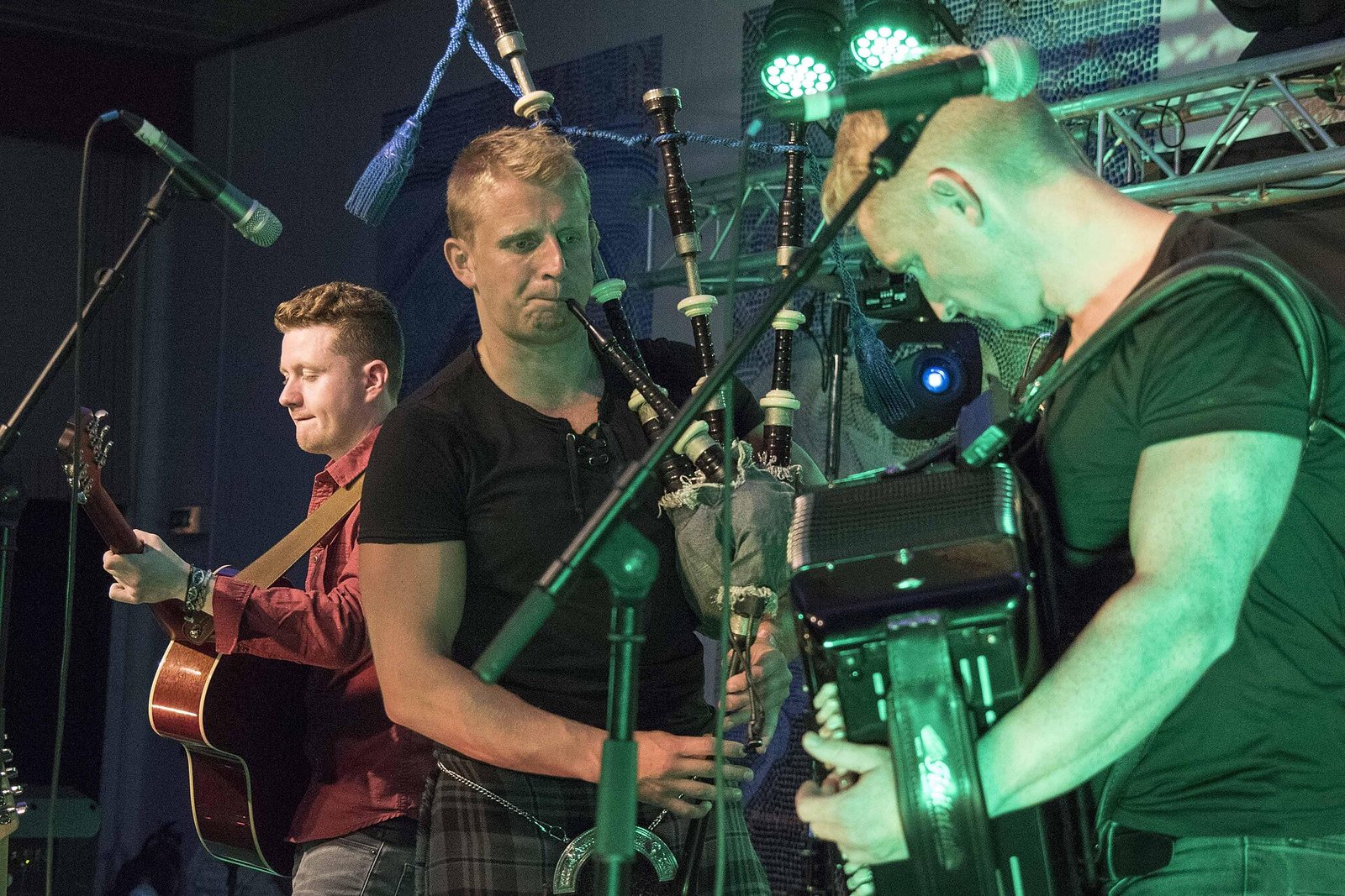 Skerryvore playing guitar, bagpipes and accordion on stage at Costa del Folk, Portugal, October 2016