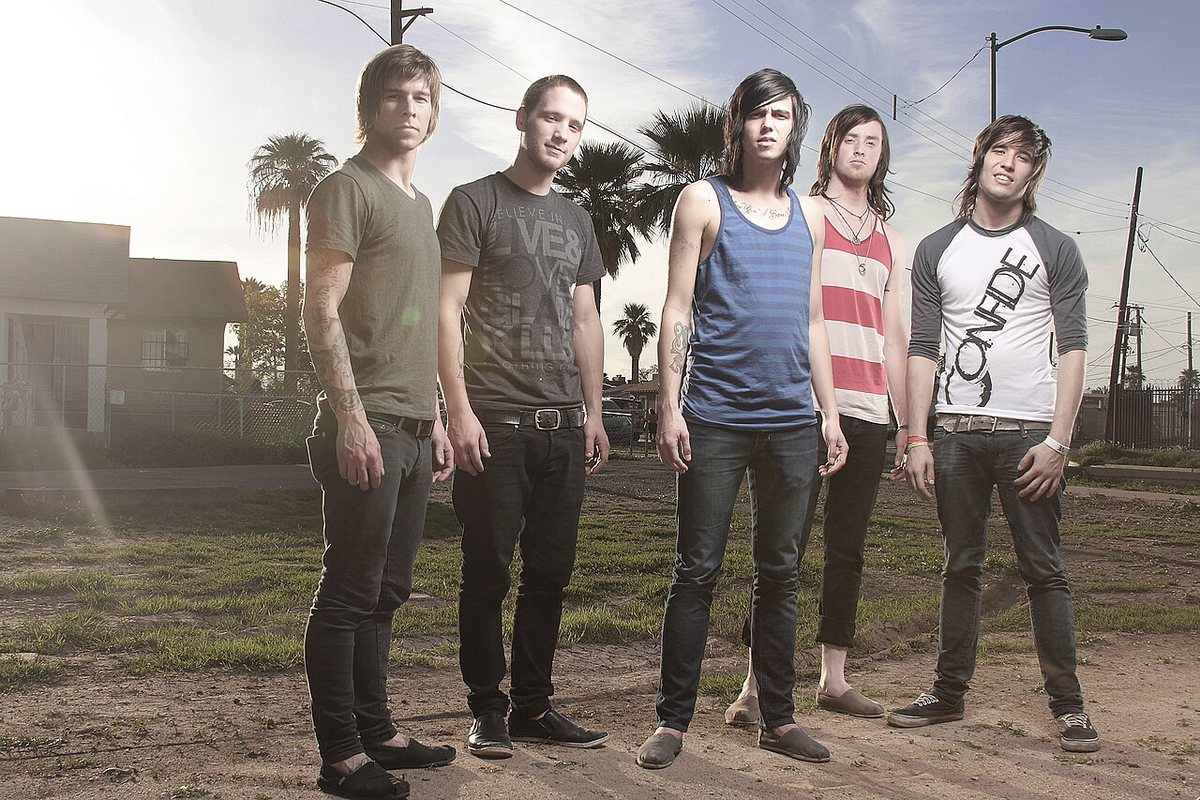 Buy Sleeping With Sirens tickets on StubOrder Sleeping With Sirens band portrait in an open lot with palm trees, 2010