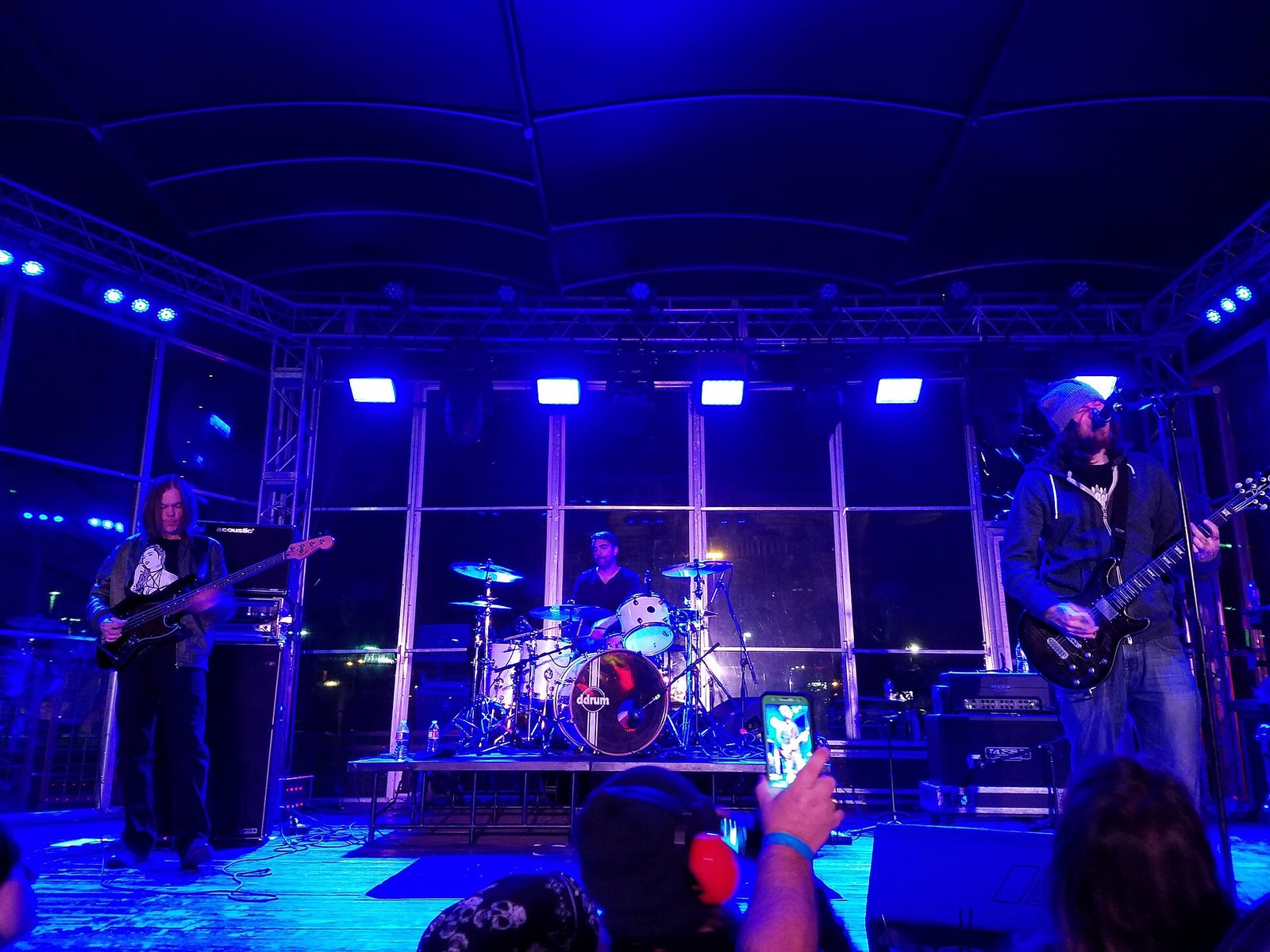 American rock band Smile Empty Soul performing on stage under blue lights, 2018