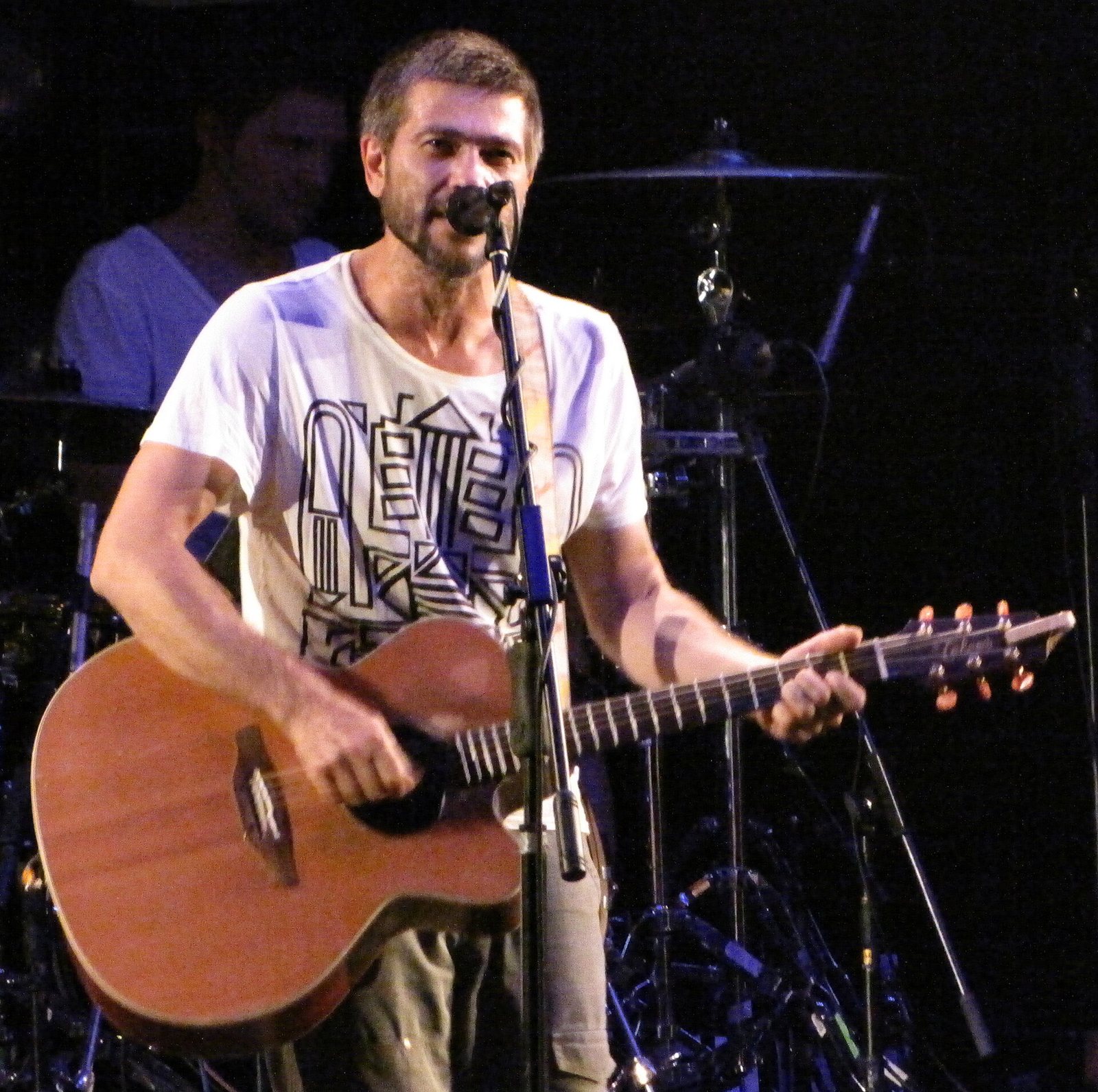 Aleksandr Vasilyev of Splean singing with an acoustic guitar at B1 Maximum club, Moscow, 2010