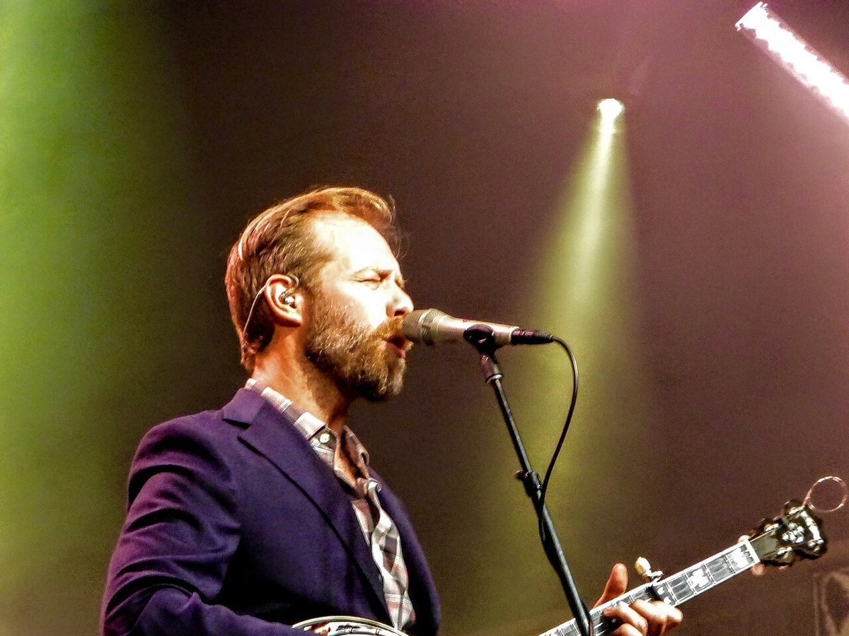 Buy Steep Canyon Rangers tickets on StubOrder Steep Canyon Rangers banjo player singing on stage at MerleFest 2017
