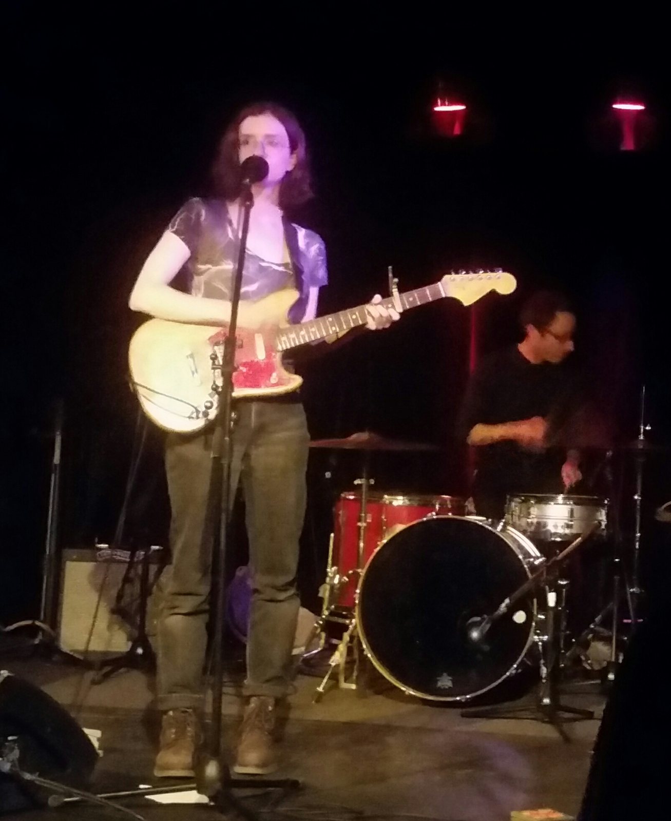 Stef Chura singing and playing guitar on stage at Divan Orange, Montreal, 2017