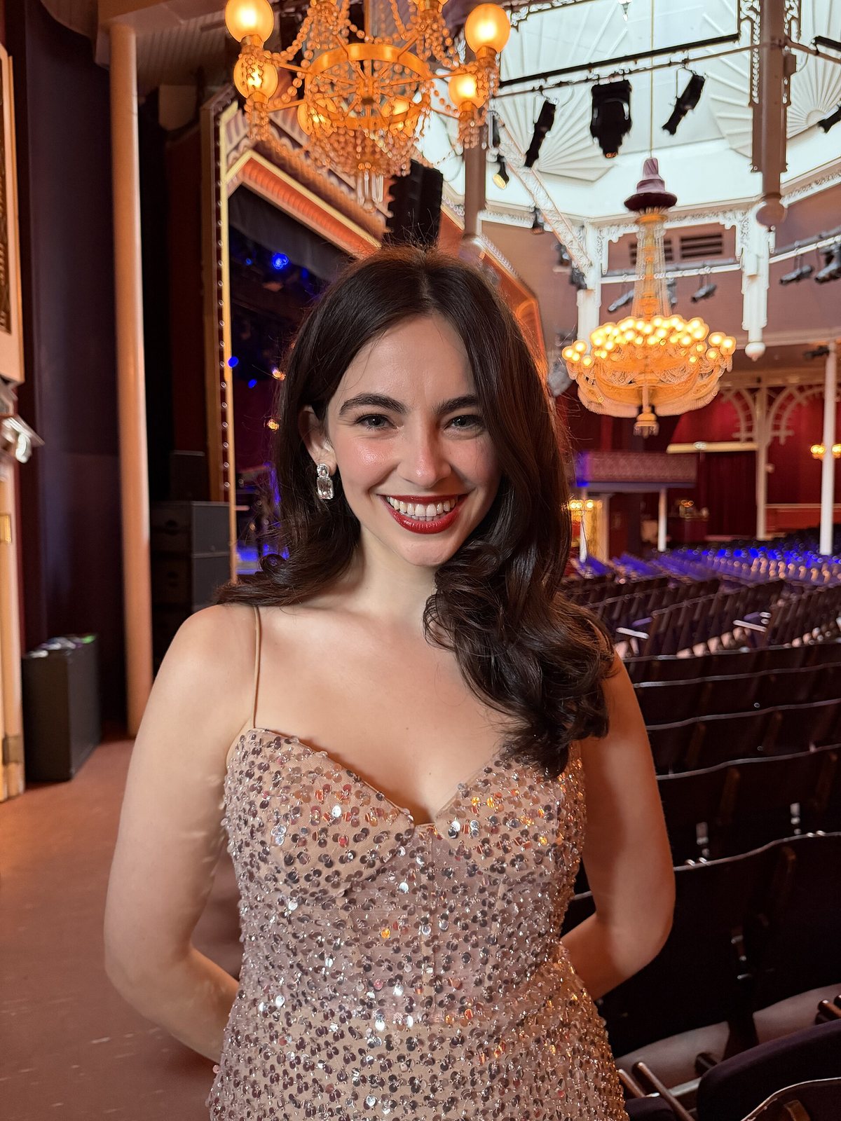Stella Cole in a sequined gown inside the Glassalen theatre at Tivoli Gardens, Copenhagen, 2026