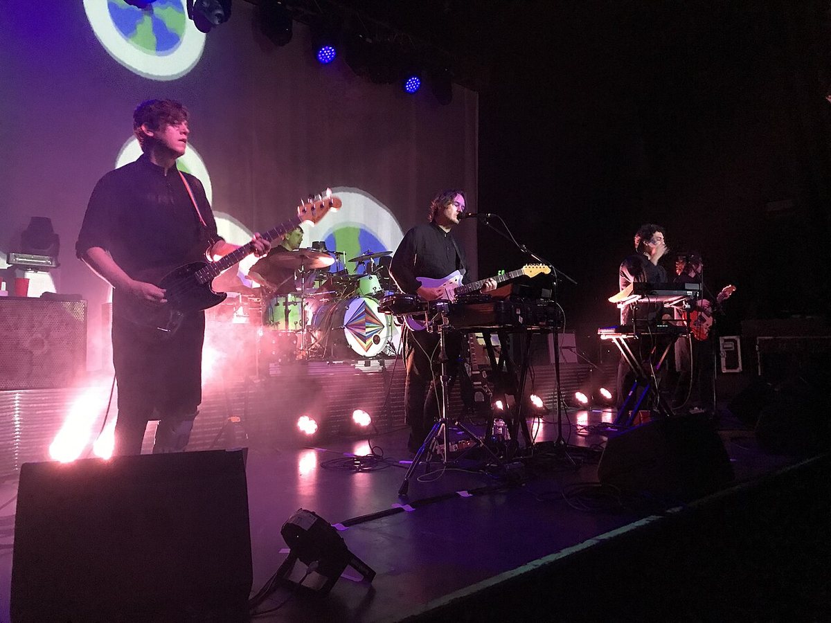 Buy STRFKR tickets on StubOrder STRFKR performing on stage in front of psychedelic projections in 2022
