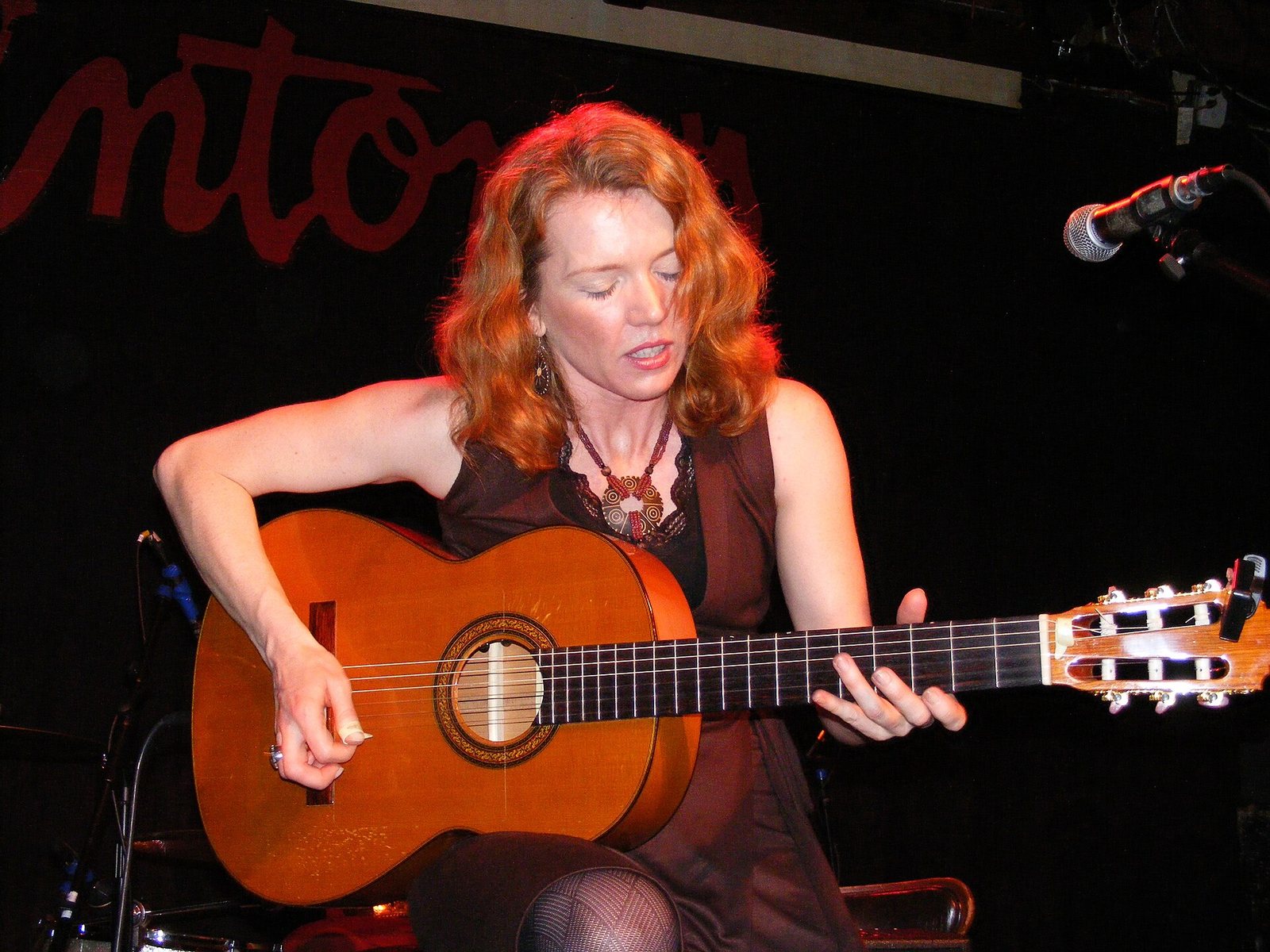 Sue Foley playing acoustic guitar on stage at Antone's, Austin, Texas, 2008