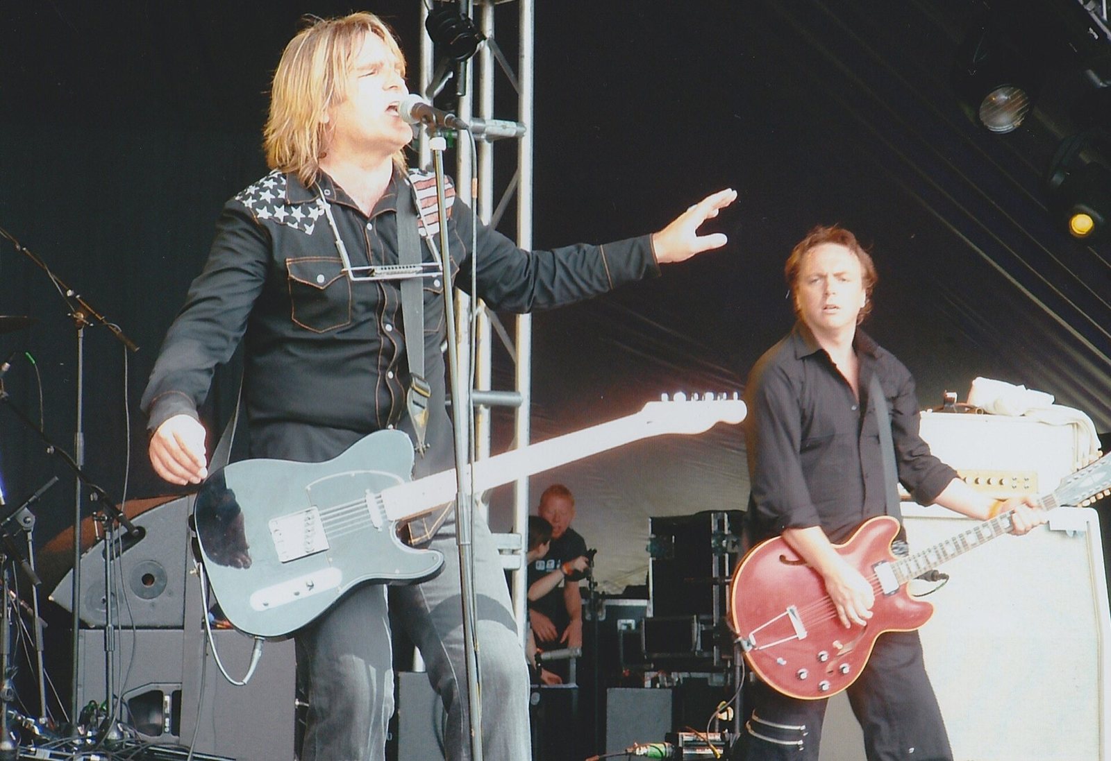 Mike Peters of The Alarm singing with a guitarist alongside at Guilfest, Guildford, 2004