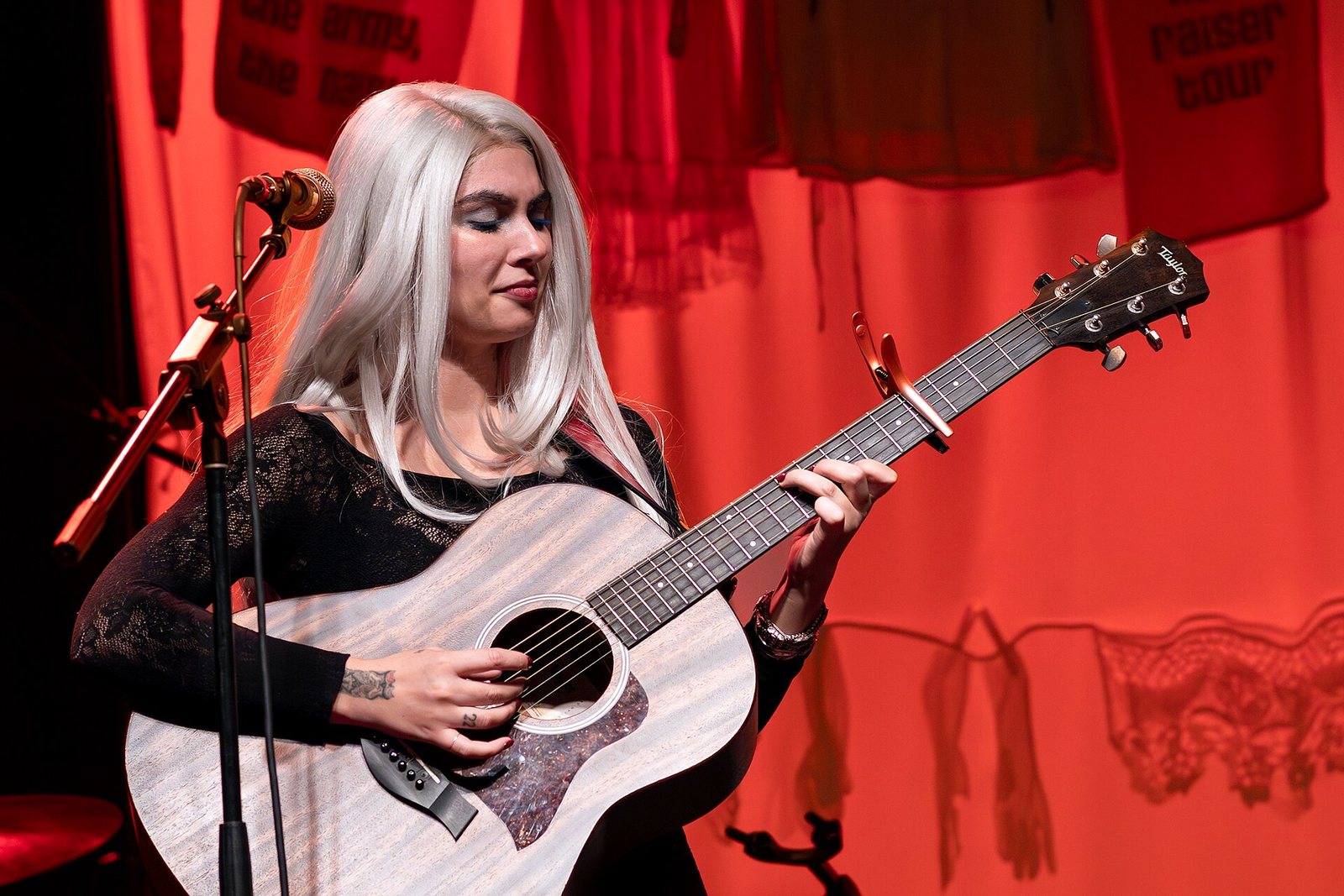 A member of The Army, The Navy playing acoustic guitar at the El Rey Theatre, Los Angeles, 2025