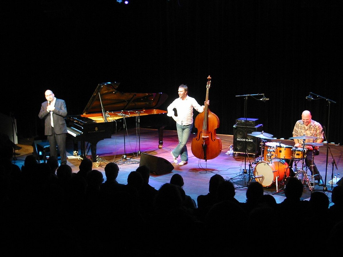 The Bad Plus on stage with grand piano, double bass and drums at a concert hall in Amsterdam, 2005