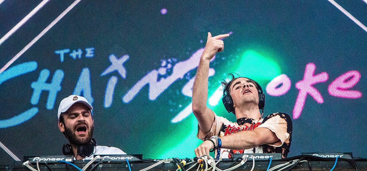 The Chainsmokers DJing in front of their name on the screen at VELD Music Festival, Toronto, 2016