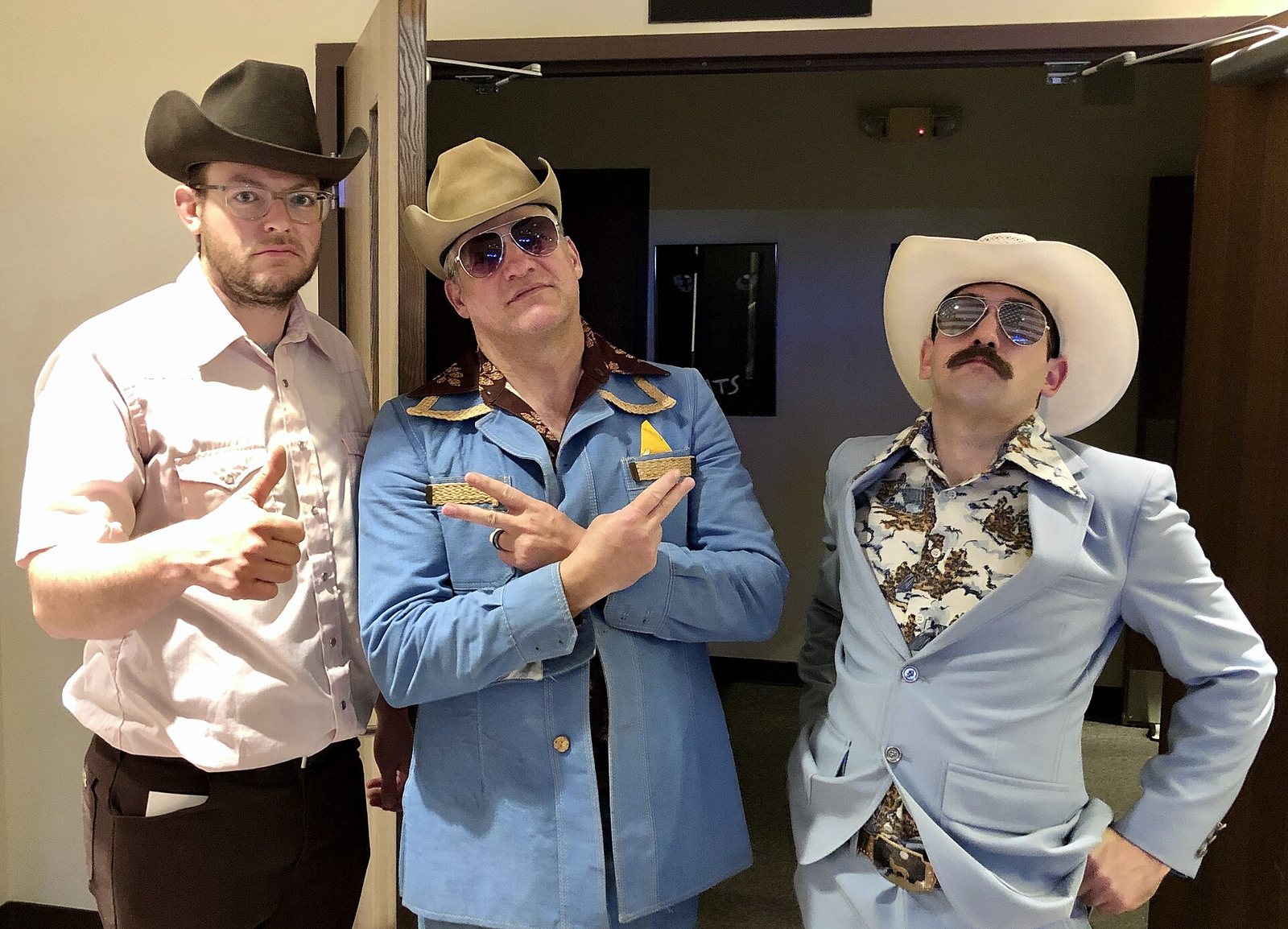 Three members of The Cleverlys posing in costume after a concert in Jackson, Tennessee, 2019