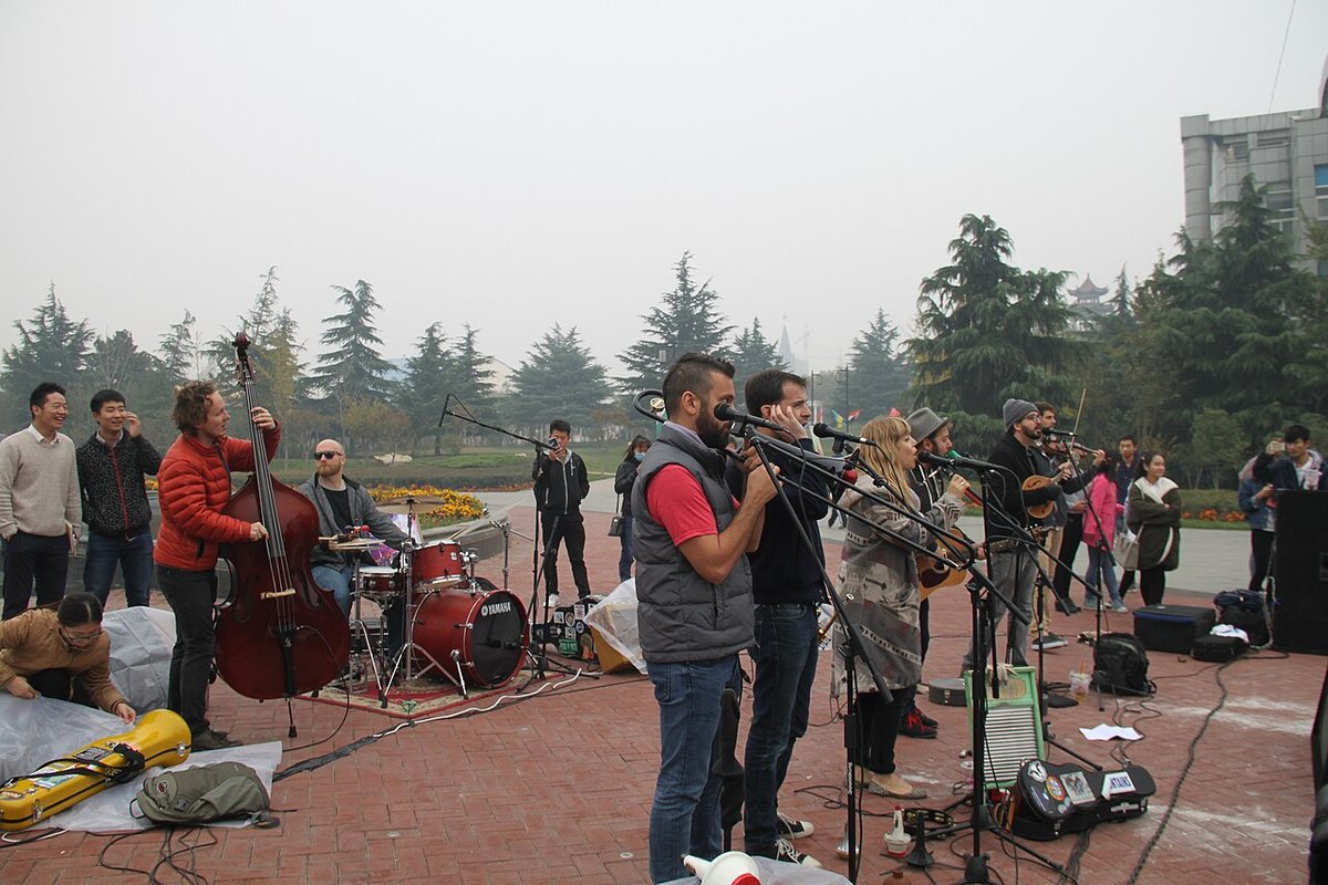 Buy The Dustbowl Revival tickets on StubOrder The Dustbowl Revival playing an outdoor set at Sias University, Xinzheng, China, 2015
