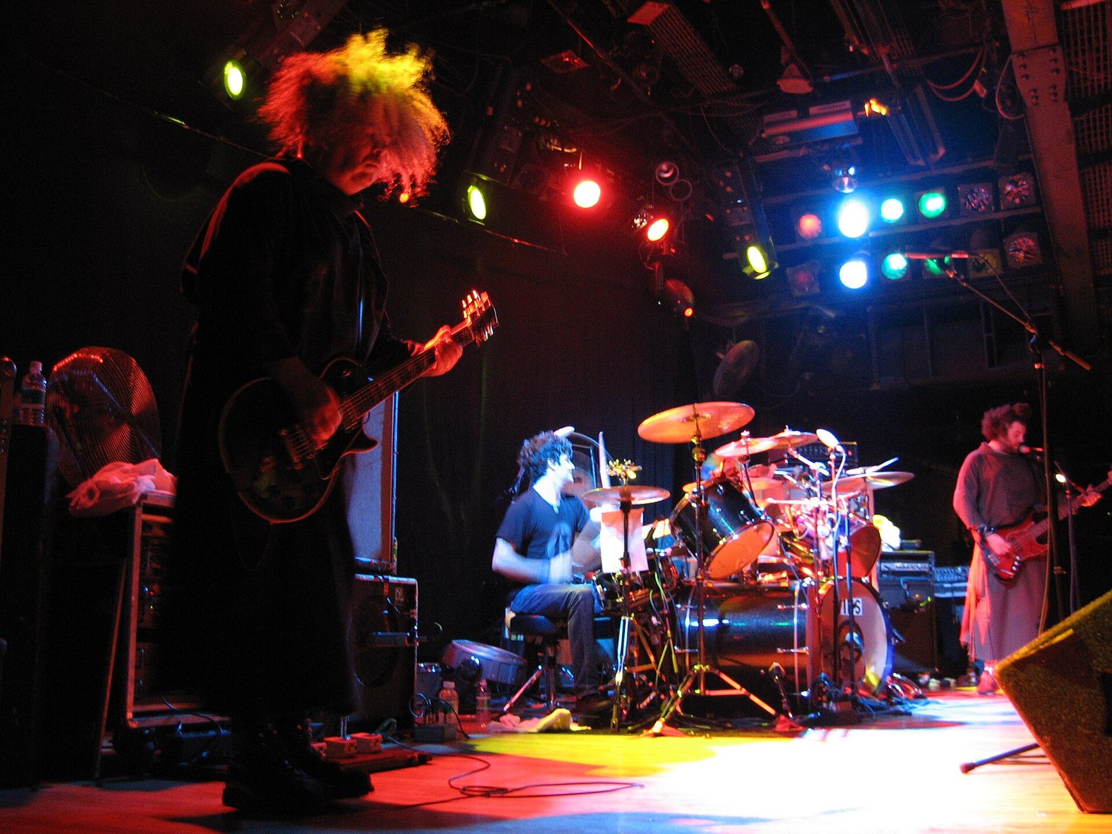 Buzz Osborne of the Melvins playing guitar on stage with the band in concert, 2006