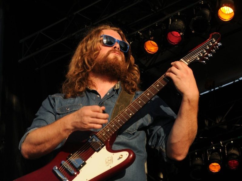 Buy The Sheepdogs tickets on StubOrder Ewan Currie of The Sheepdogs playing guitar at Ottawa Bluesfest, 2011