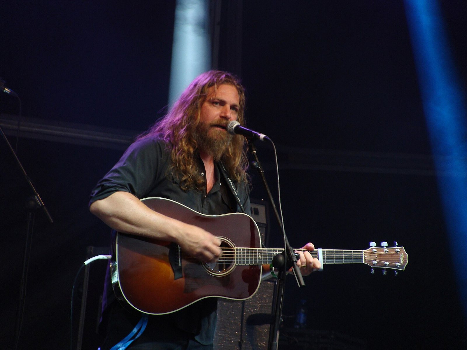 Jake Smith of The White Buffalo singing with an acoustic guitar at Azkena Rock Festival, Vitoria-Gasteiz, Spain, 2015