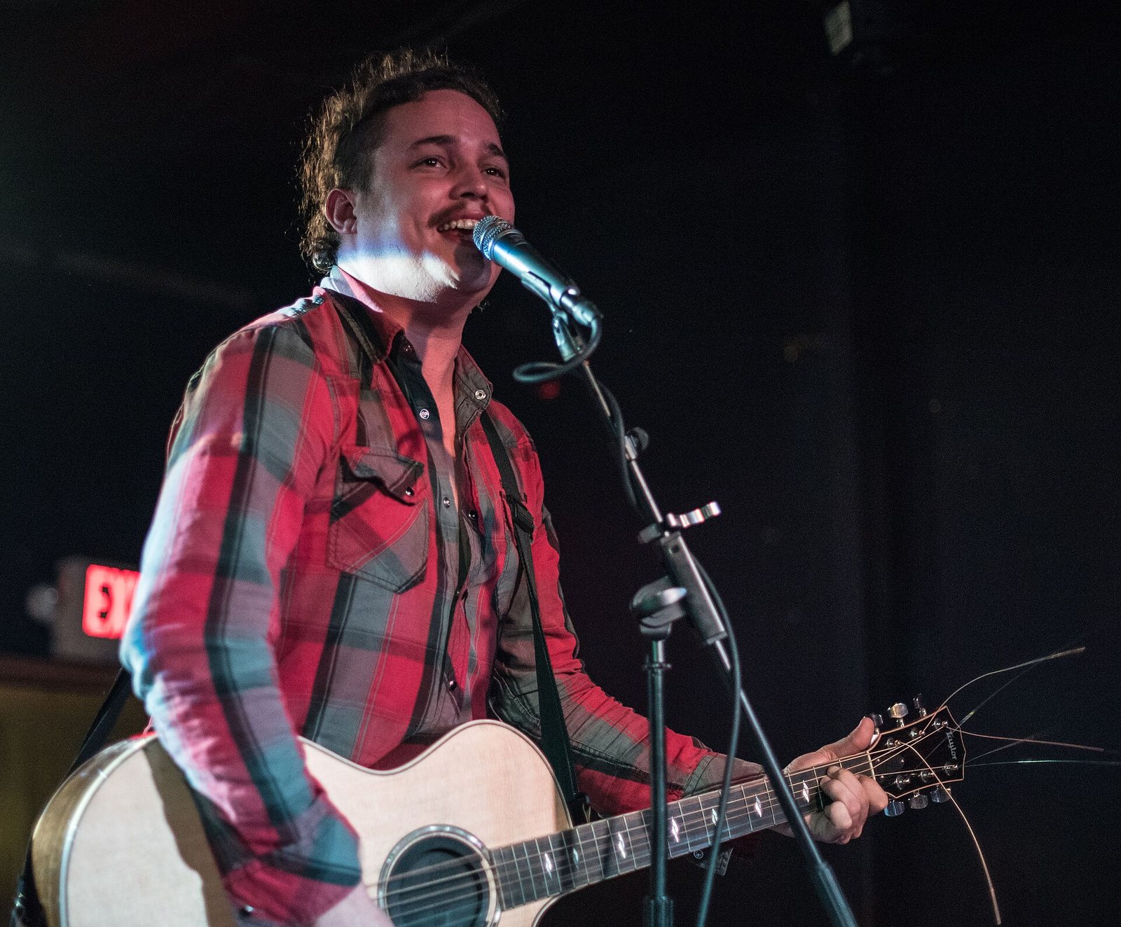 Nate Cook of The Yawpers singing with an acoustic guitar at Rock & Roll Hotel, Washington DC, 2015