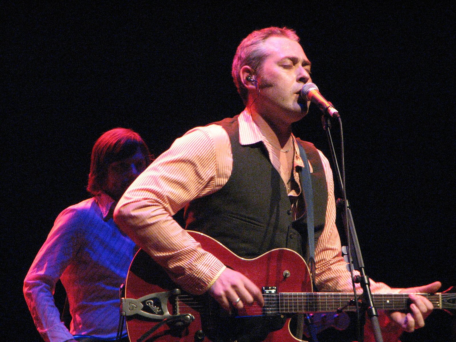 Stuart Staples of Tindersticks singing and playing guitar at the Royal Festival Hall, London, 2008
