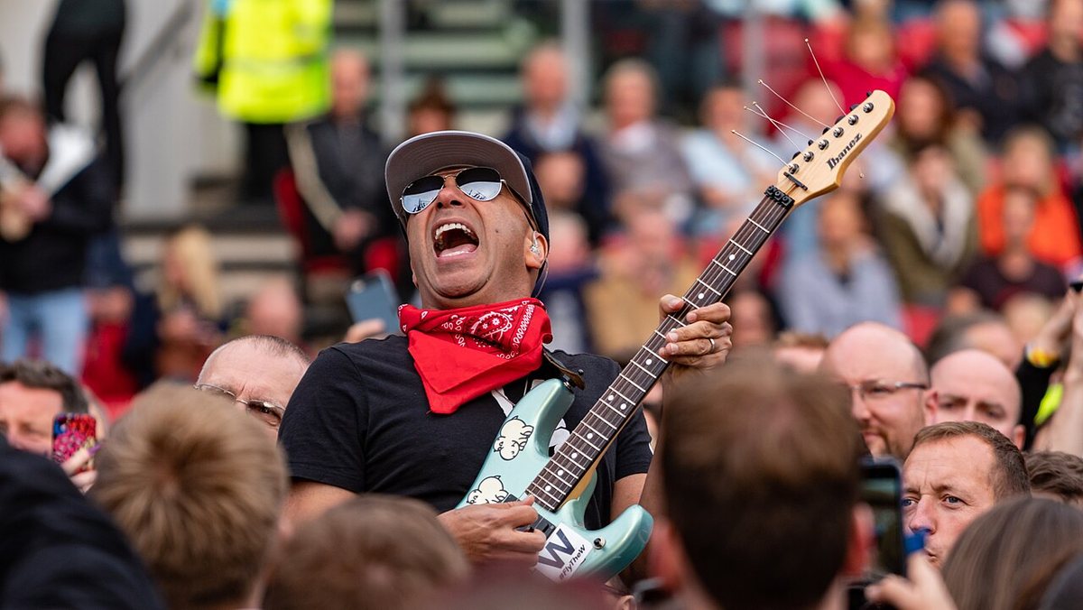 Tom Morello playing guitar among the crowd at Ashton Gate, Bristol, June 2019