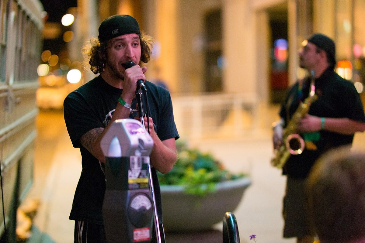 Tropidelic singer and saxophonist performing on a Denver street, September 2014