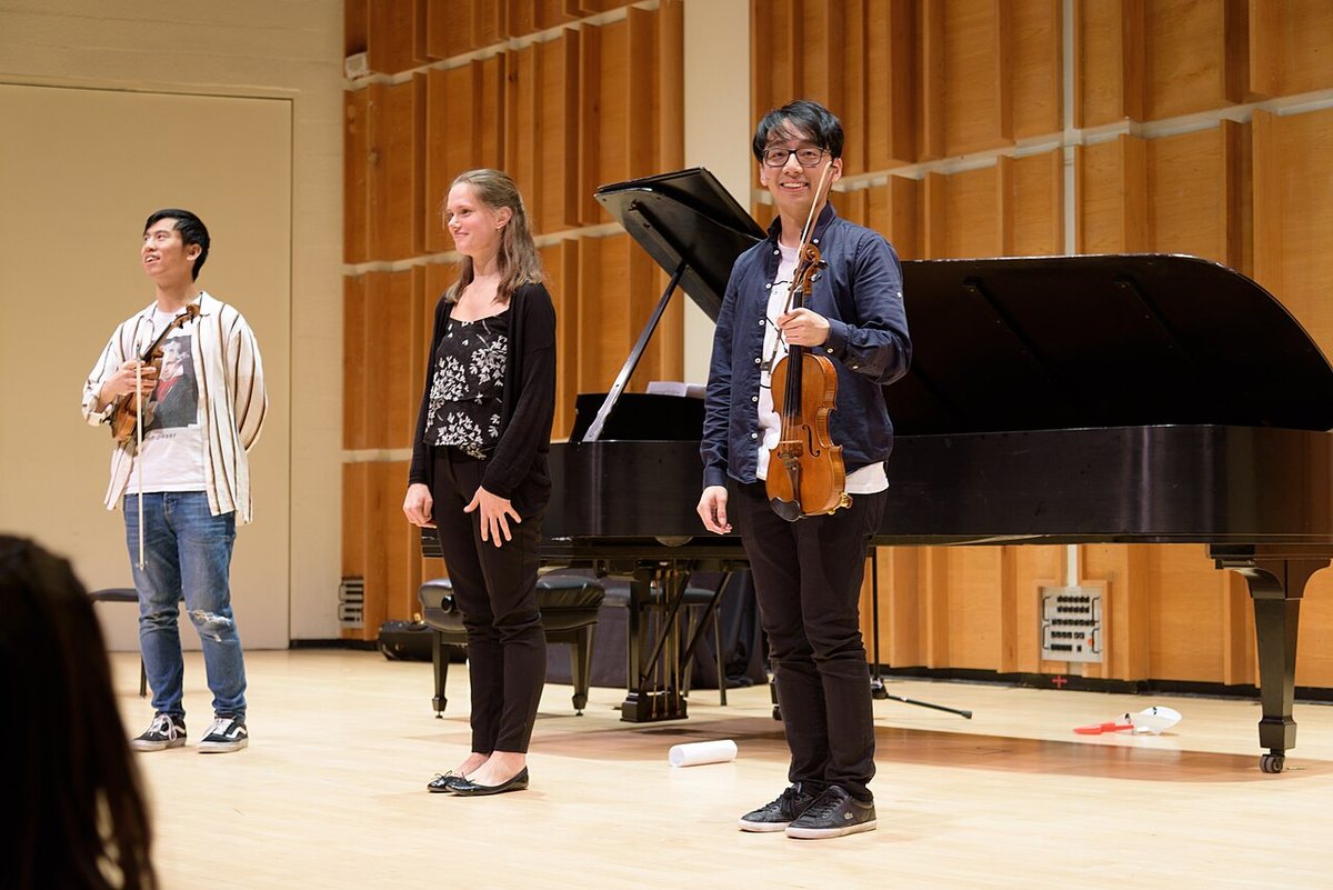Buy TwoSet Violin tickets on StubOrder TwoSet Violin's Eddy Chen and Brett Yang with pianist Sophie Druml on stage at Merkin Concert Hall, New York, 2018
