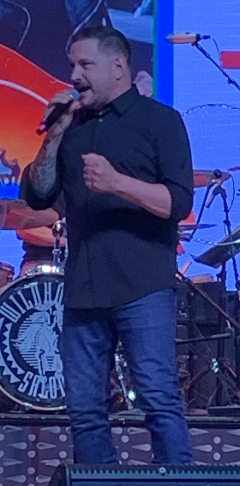Ty Herndon singing on stage in 2023