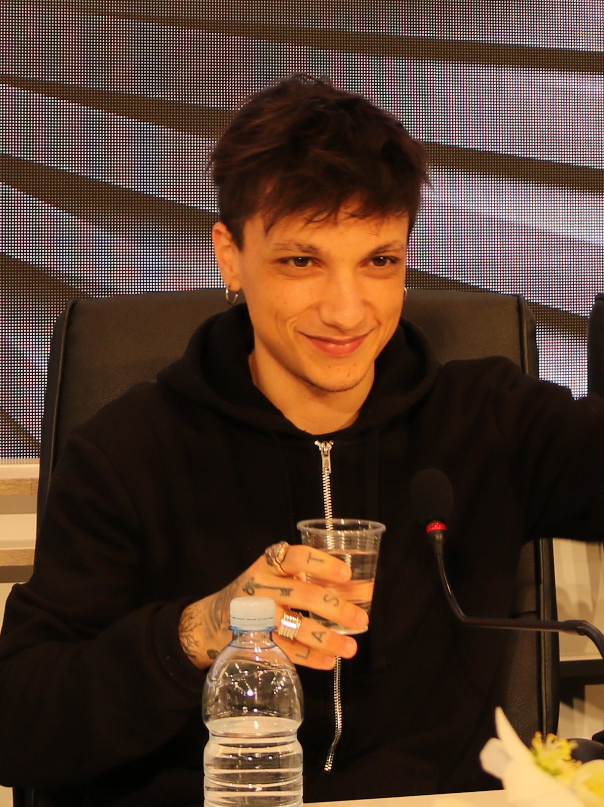 Ultimo smiling at a press conference during the 2018 Sanremo Music Festival