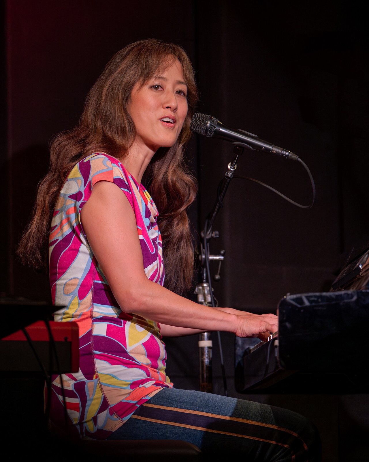 Vienna Teng singing at the piano at McCabe's Guitar Shop, September 2024