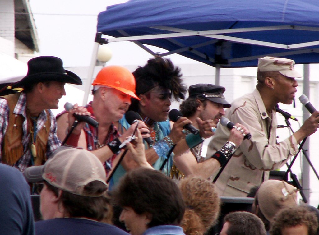 Village People singing on an outdoor stage in Asbury Park, New Jersey, 2006