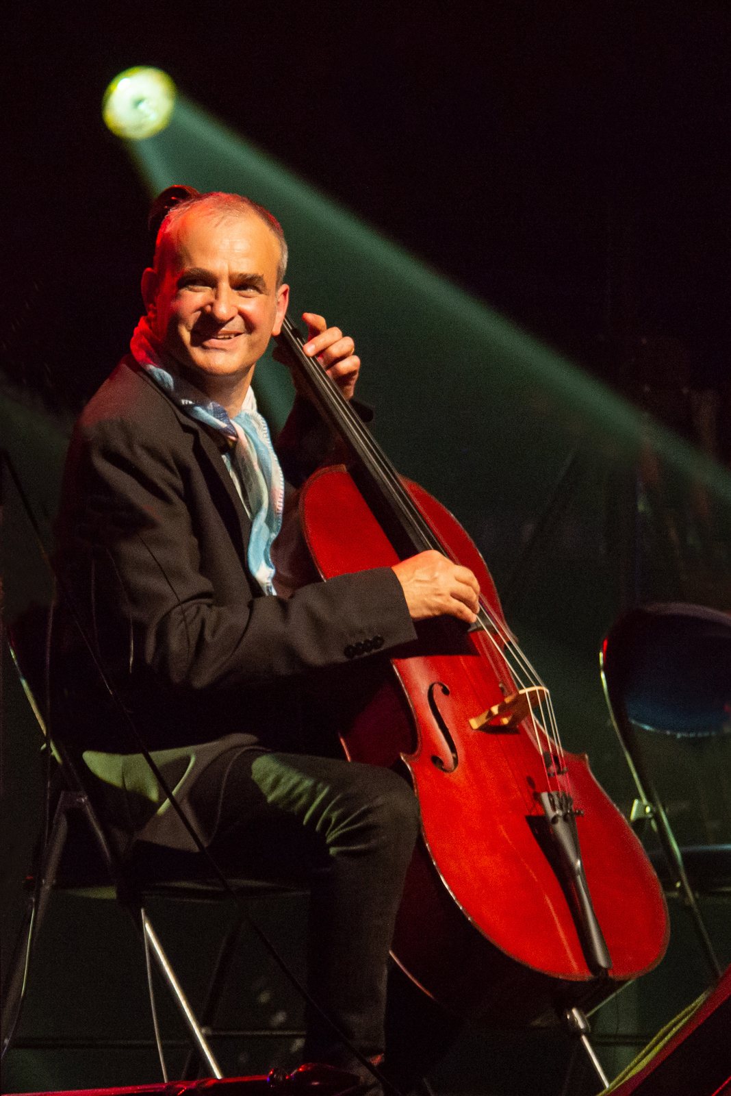 Vincent Segal playing cello on stage at the Jazz sous les Pommiers festival, Coutances, France, 2021