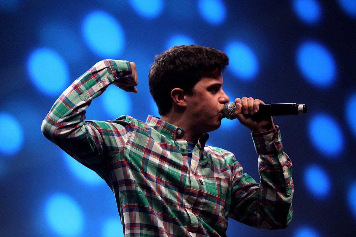George Watsky rapping on stage at VidCon 2012, Anaheim Convention Center, California