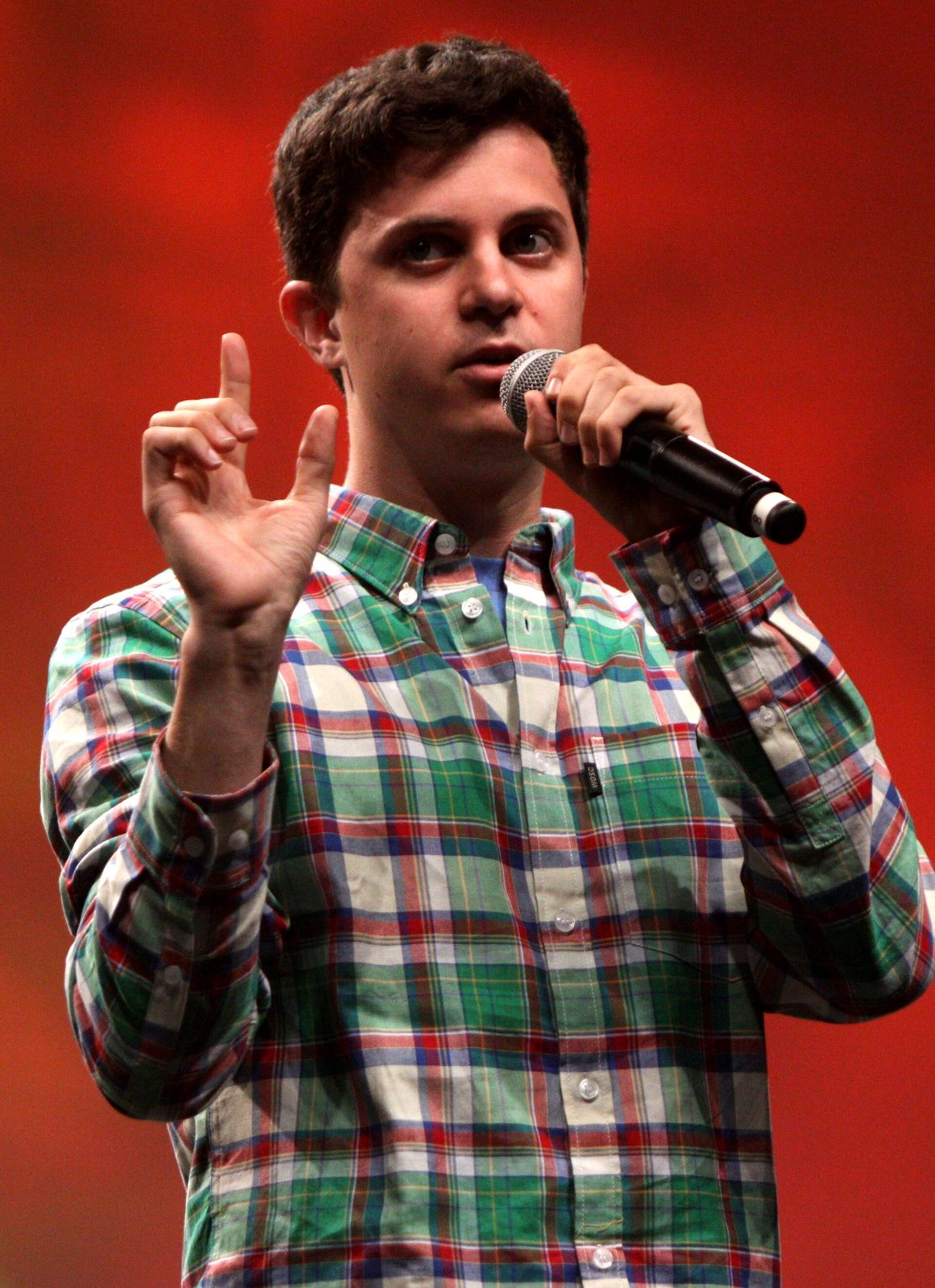 George Watsky performing with a microphone at VidCon 2012 in Anaheim, California