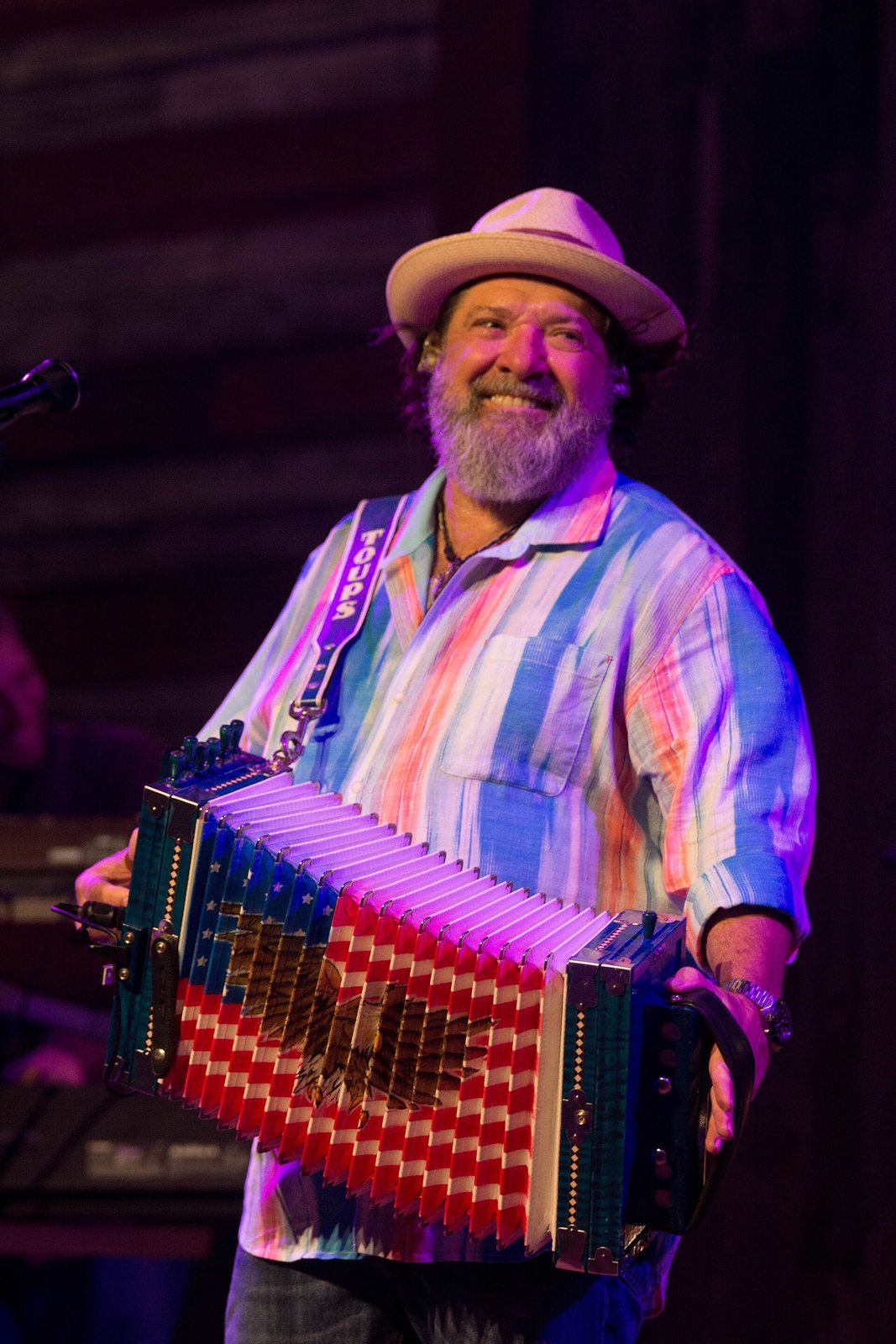Wayne Toups playing accordion on stage at the Redneck Country Club, 2017