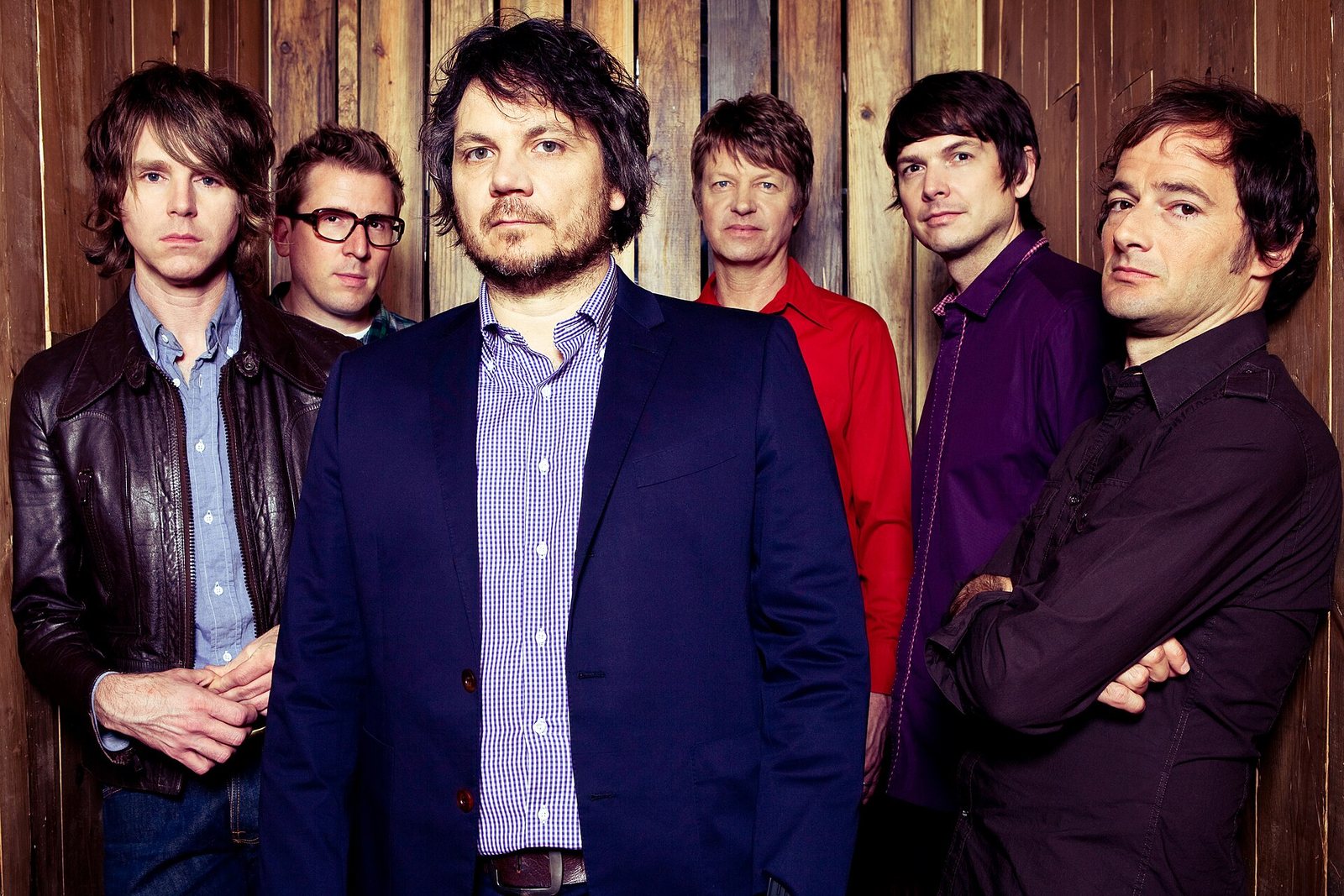 Wilco posed against a wooden wall at Solid Sound Festival, Massachusetts Museum of Contemporary Art, 2011