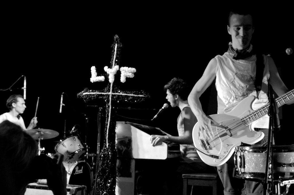 Wu Lyf performing on stage at Midi Festival, France, 2010, in black and white