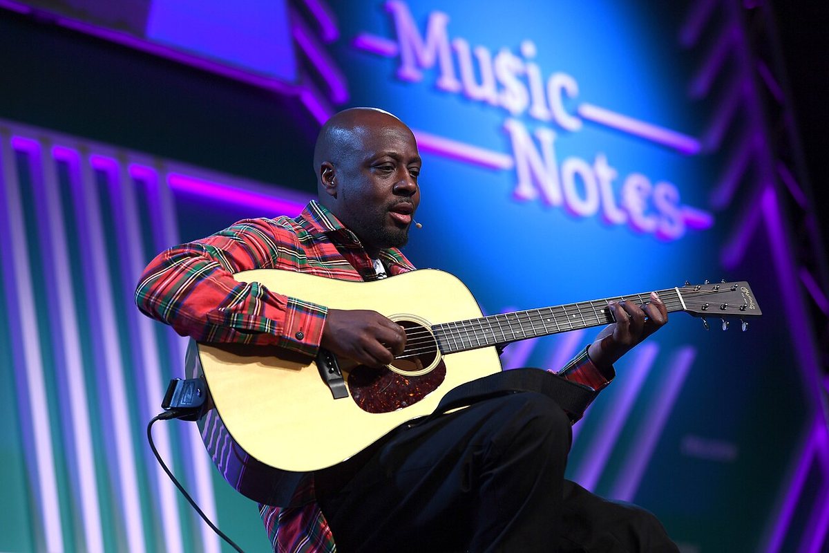 Buy Lauryn Hill & Wyclef Jean tickets on StubOrder Wyclef Jean playing acoustic guitar on the Music Notes stage at Collision 2018, New Orleans
