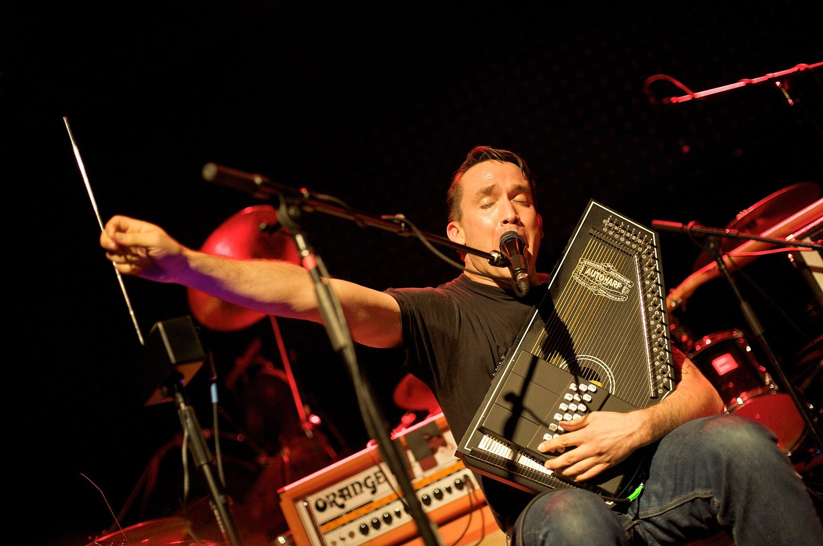 Jamie Stewart of Xiu Xiu playing autoharp on stage at the Venue nightclub, Vancouver, 2012