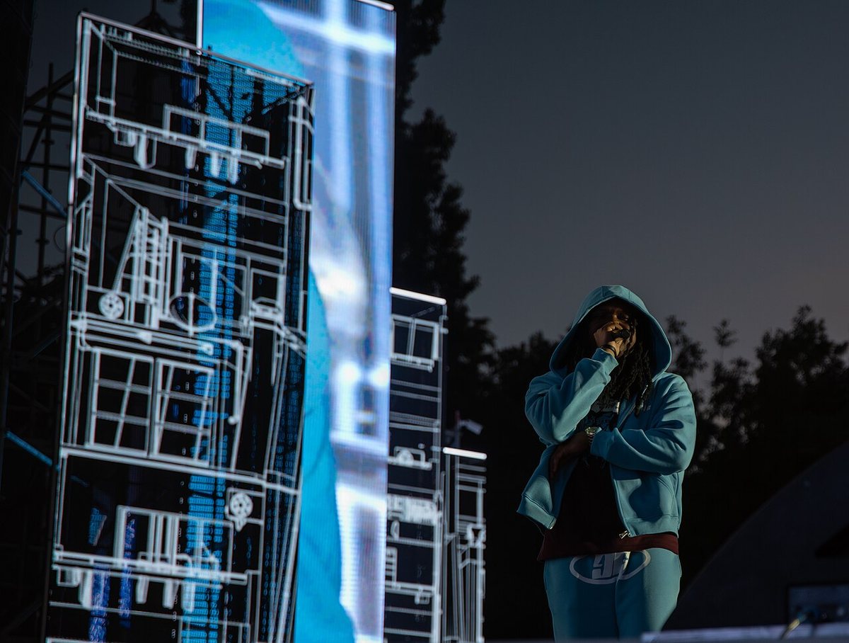 Young Nudy on stage beside LED screens at Clout Festival, Warsaw, 2024