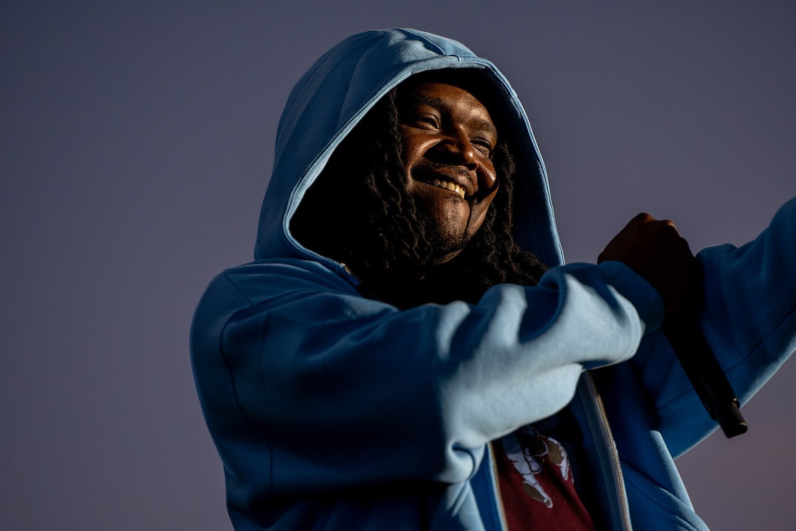 Young Nudy performing in a blue hoodie at Clout Festival, Warsaw, 2024