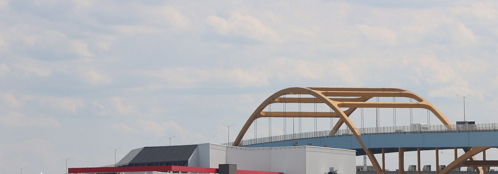 Exterior of the American Family Insurance Amphitheater at Henry Maier Festival Park in Milwaukee, with the Hoan Bridge arching behind the venue - American Family Insurance Amphitheater tickets