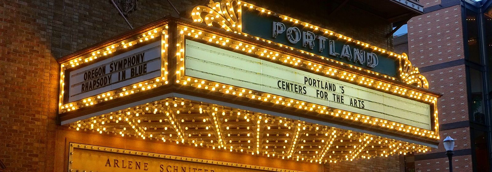 Illuminated Portland marquee above the entrance of the Arlene Schnitzer Concert Hall in Portland, Oregon, at dusk - Arlene Schnitzer Concert Hall tickets