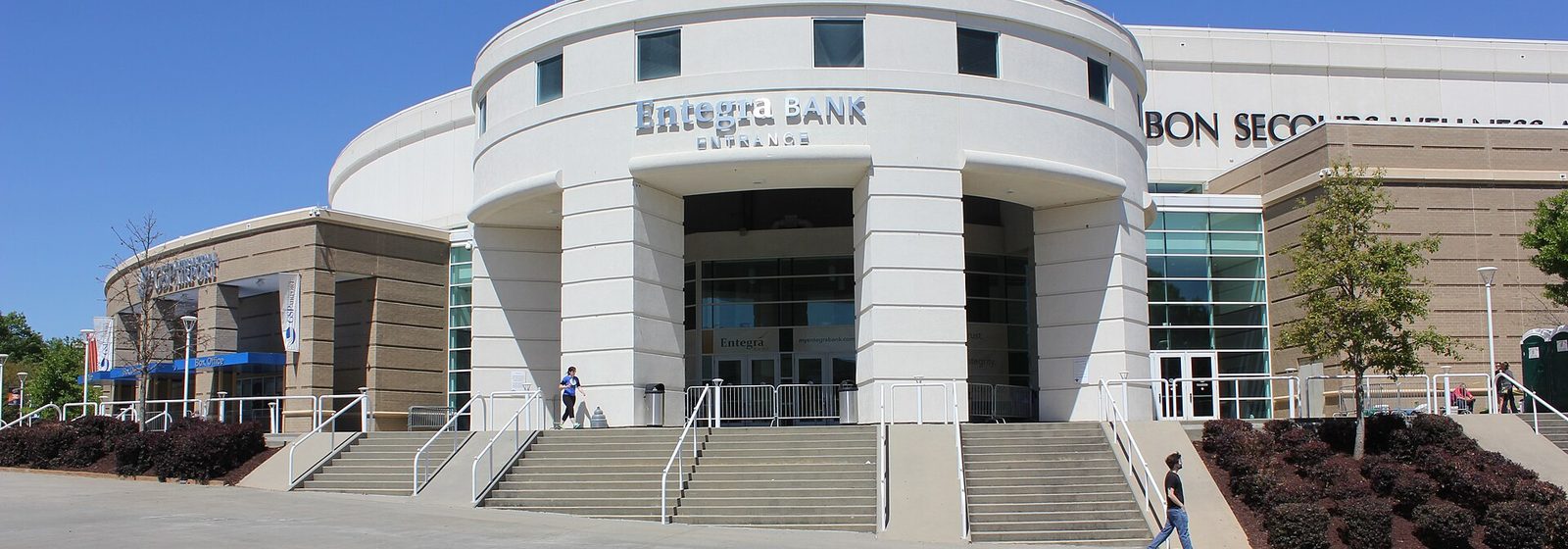 Main entrance rotunda and facade of Bon Secours Wellness Arena in Greenville, South Carolina, under a clear sky - Bon Secours Wellness Arena tickets
