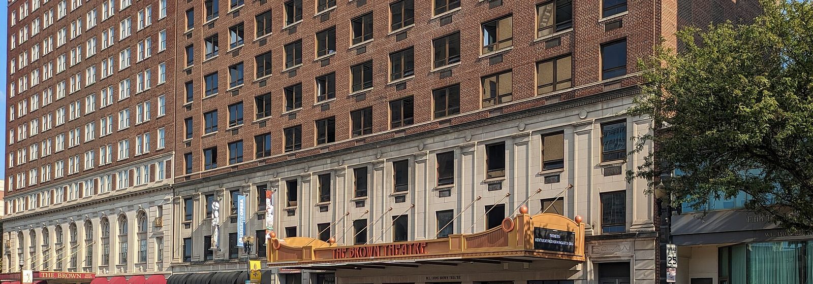 Street-level view of the brick facade and gold marquee of the Brown Theatre in downtown Louisville, Kentucky - Brown Theatre at The Kentucky Center tickets