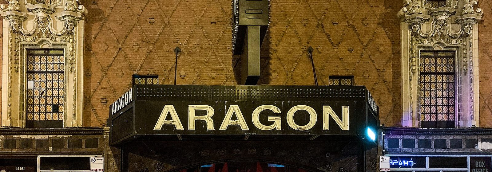 Night view of the ornate terra-cotta facade and Aragon marquee of the Byline Bank Aragon Ballroom on Lawrence Avenue in Chicago's Uptown neighborhood - Byline Bank Aragon Ballroom tickets