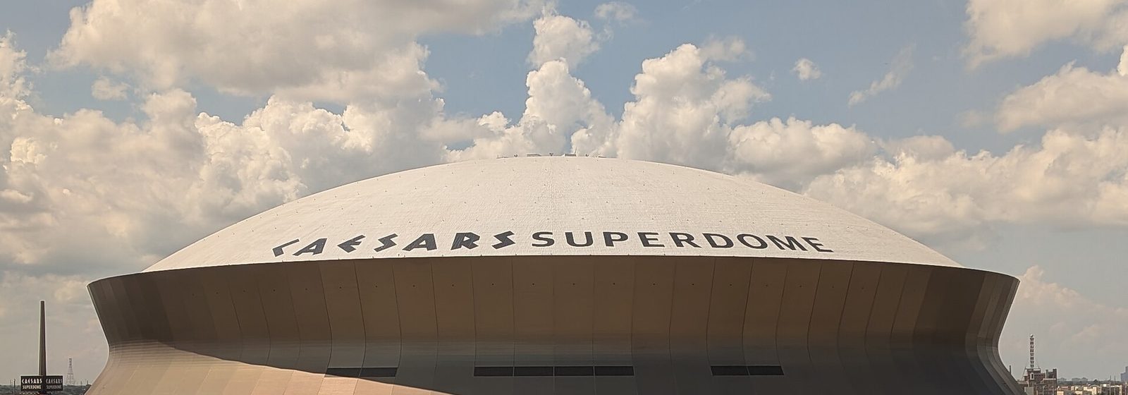 Airports near Caesars Superdome Daytime exterior view of the domed Caesars Superdome stadium in New Orleans, Louisiana - Caesars Superdome tickets