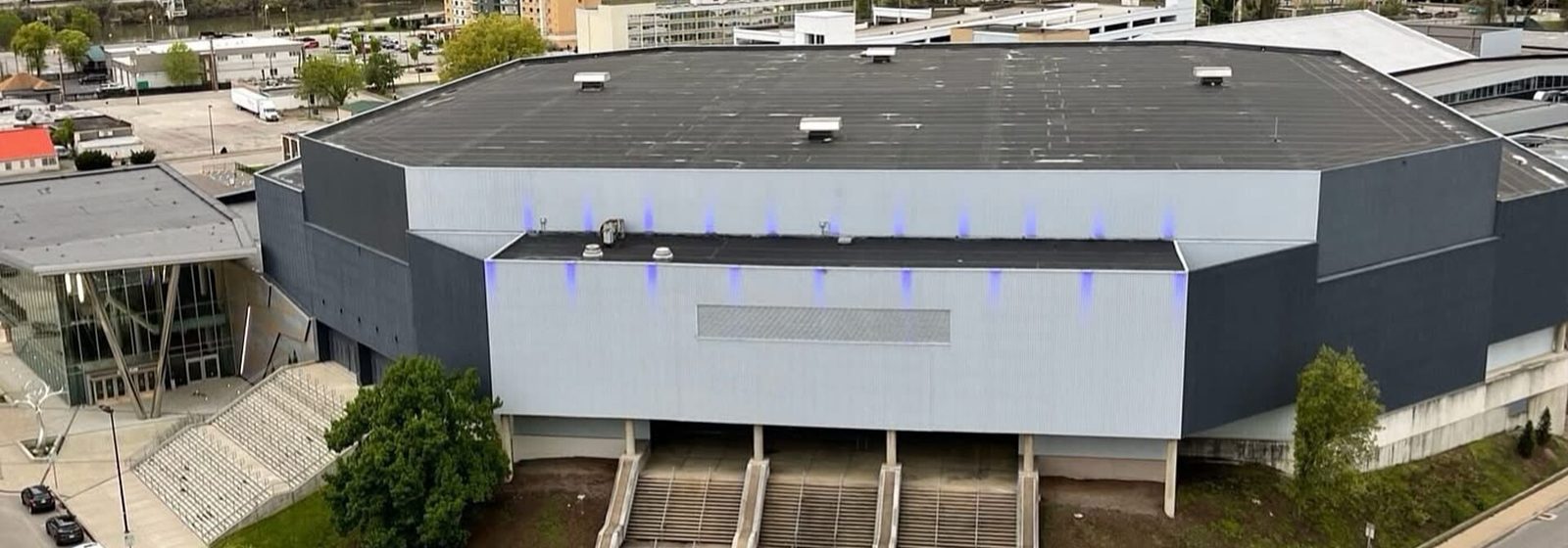 Elevated exterior view of the Charleston Coliseum & Convention Center beside the Kanawha River in downtown Charleston, West Virginia - Charleston Coliseum & Convention Center - Charleston tickets