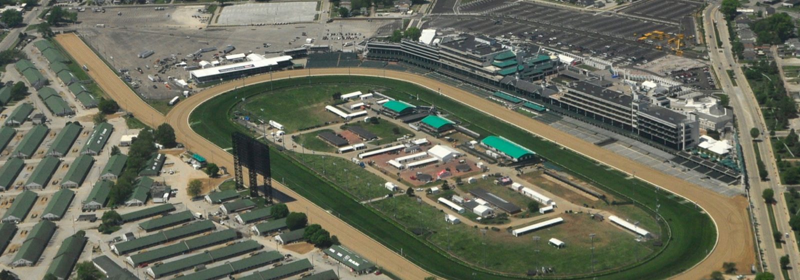 Aerial view of the Churchill Downs thoroughbred racetrack, grandstand, and stable barns in Louisville, Kentucky - Churchill Downs tickets