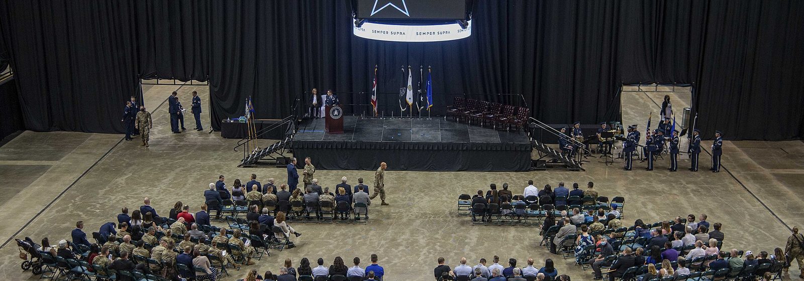 Wide interior view of the arena floor and lower seating bowl of the Ervin J. Nutter Center in Dayton, Ohio, during a 2022 ceremony - EJ Nutter Center tickets