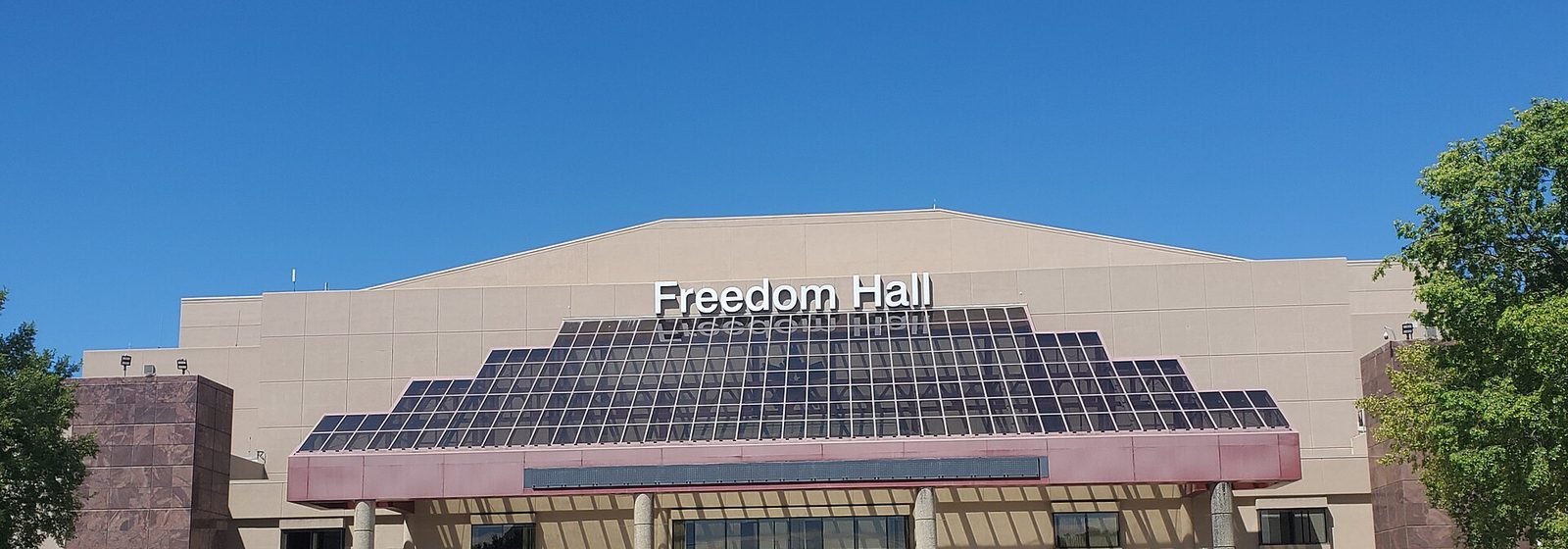 Front exterior facade of Freedom Hall at the Kentucky Exposition Center in Louisville, Kentucky, with the venue name displayed above the entrance - Freedom Hall At Kentucky State Fair tickets